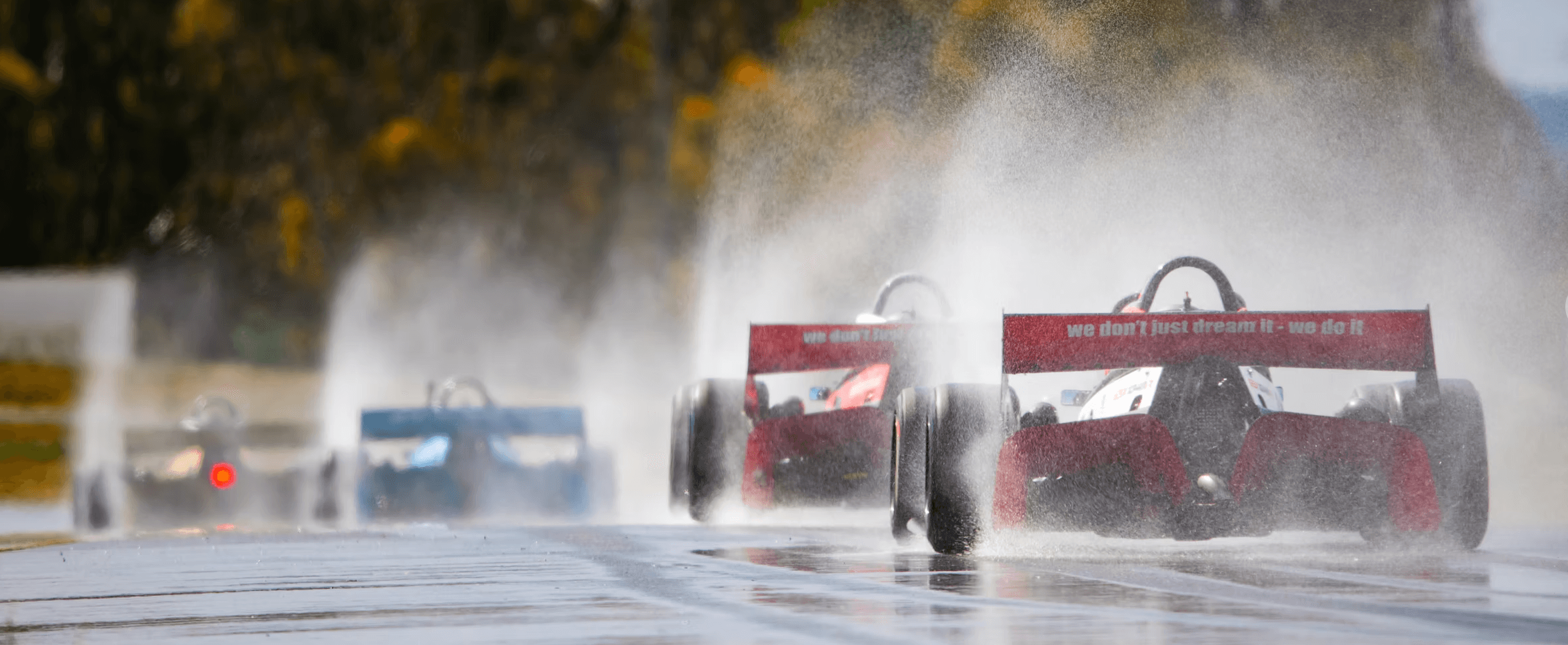 Red X1 in the rain — dramatic spray