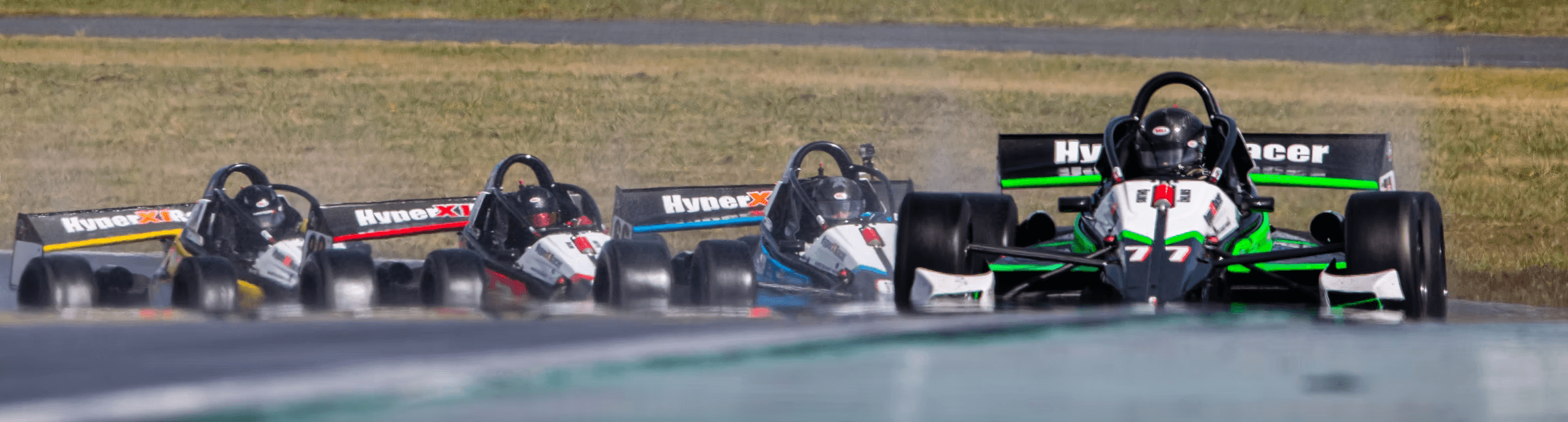 Green and black X1 leading the pack