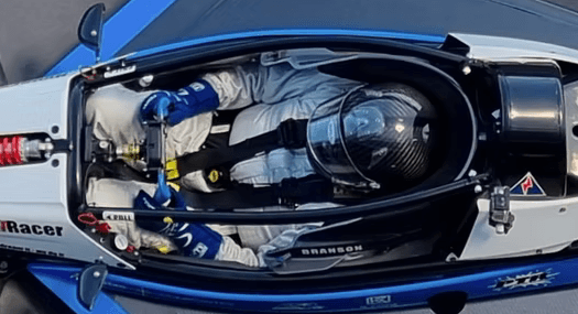 Driver strapped in — overhead cockpit view