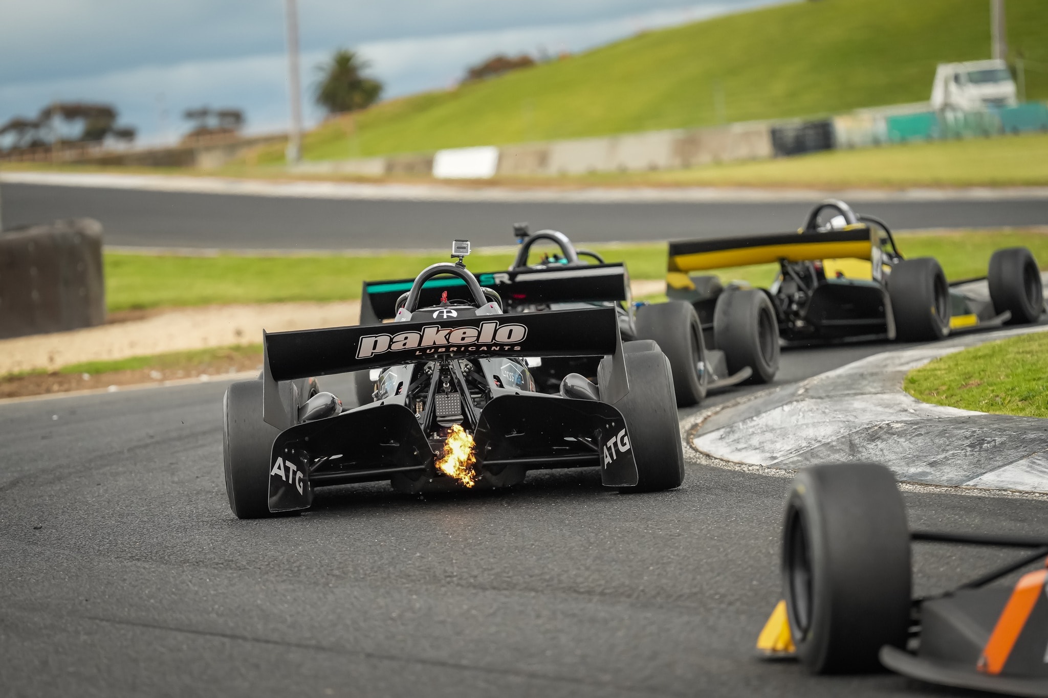 X1 with sparks and flames during pack racing