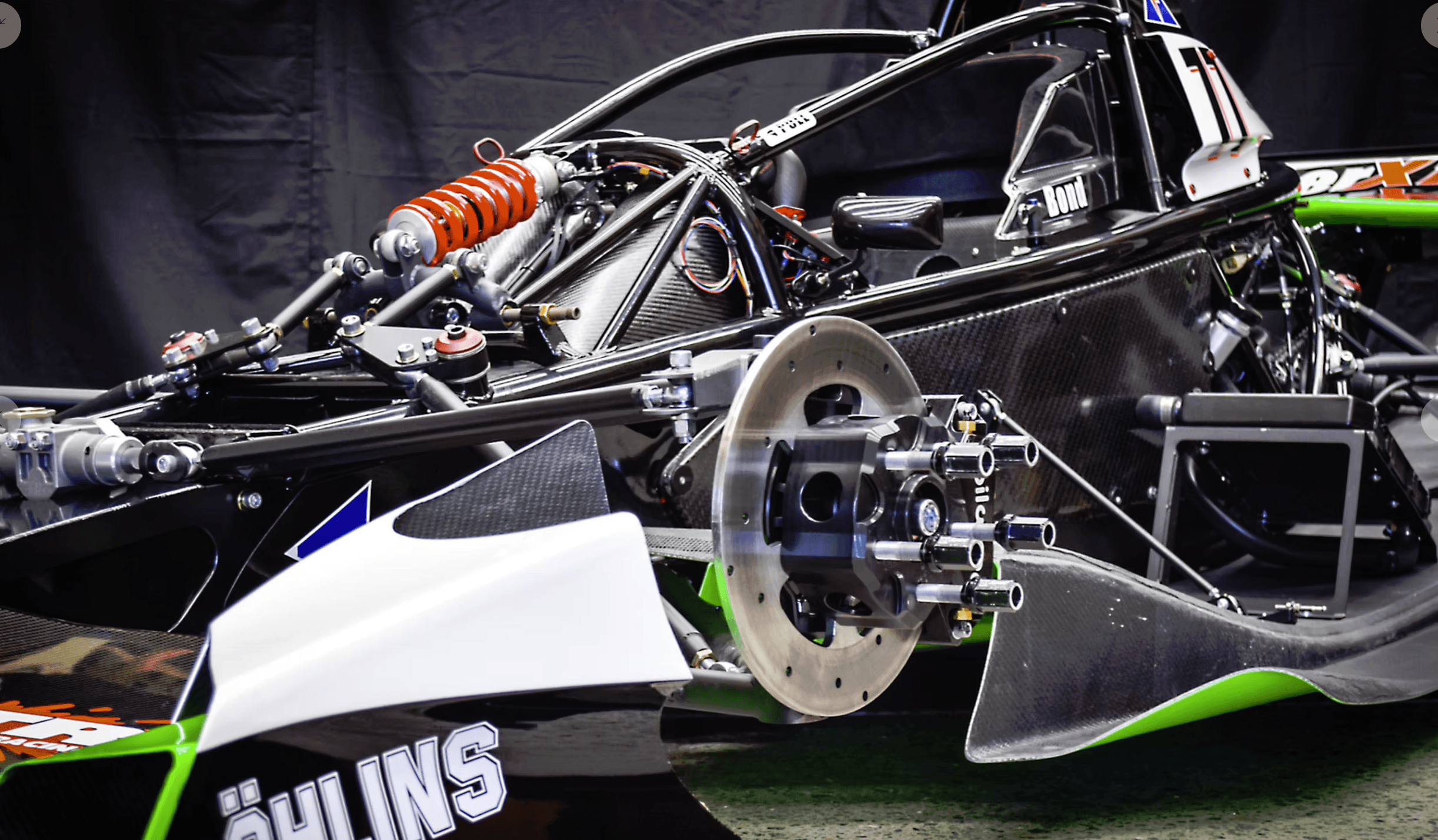 Ohlins suspension, brake rotor, and carbon bodywork