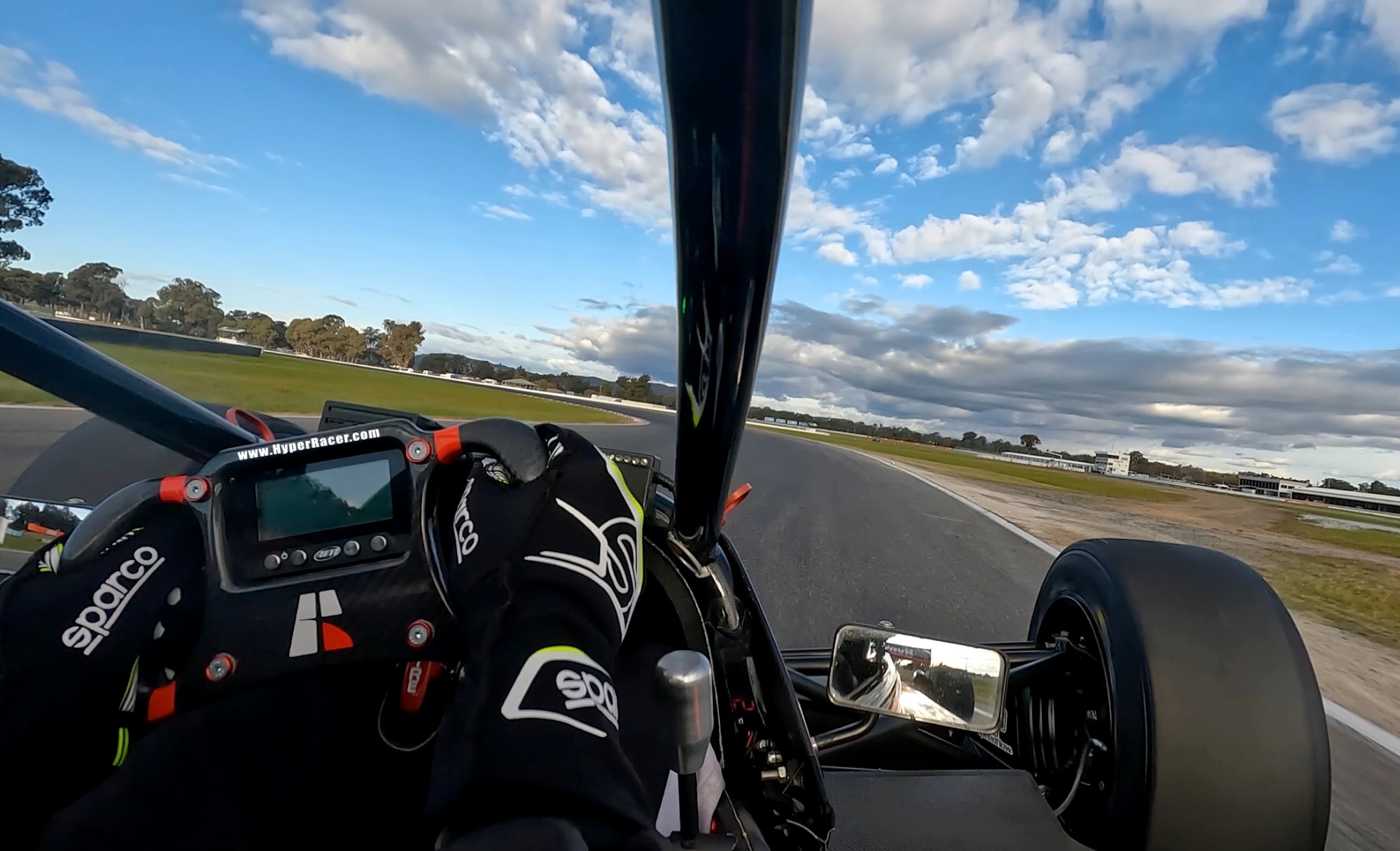 Onboard POV — hands on wheel at speed