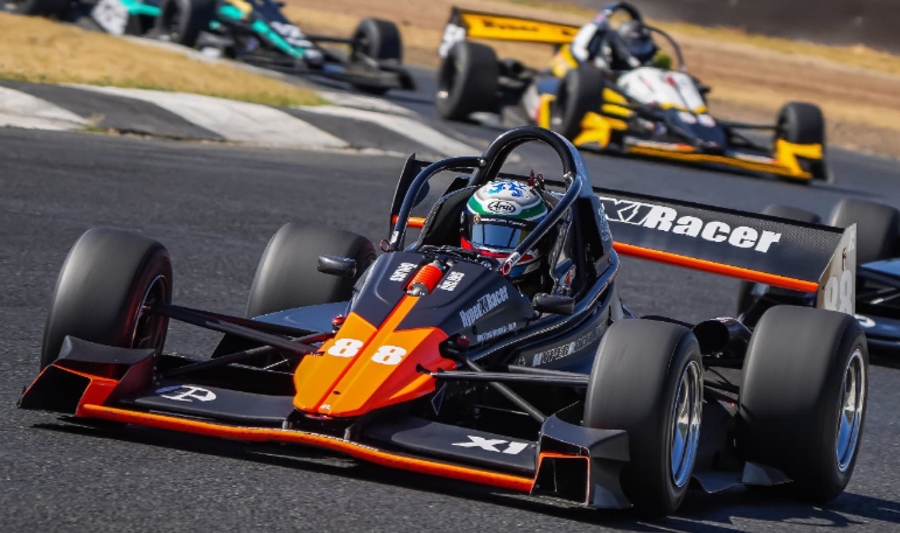 X1 pack racing — leading through the corner